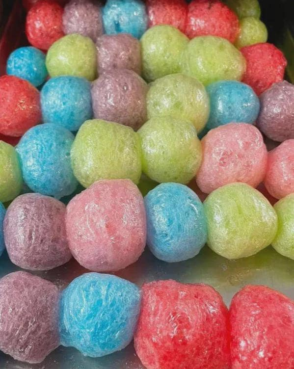 Assorted flavors of freeze dried jolly ranchers on a tray 