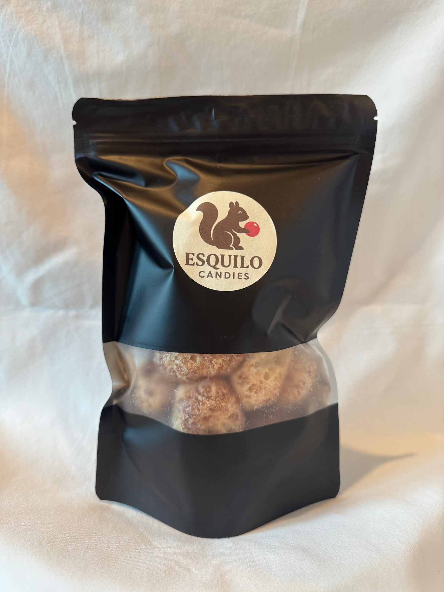 Large bag of freeze-dried chocolate caramel Esquilo candies on a white background